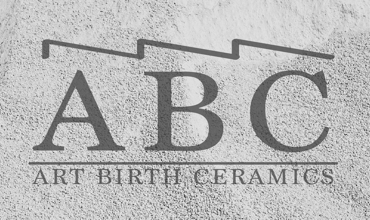 ART BIRTH CERAMICS — ABC logo etched onto plaster wall
